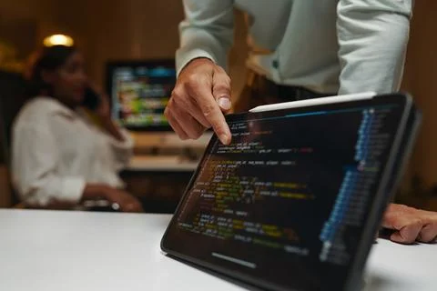 Developer Pointing at Programming Code 스톡 사진