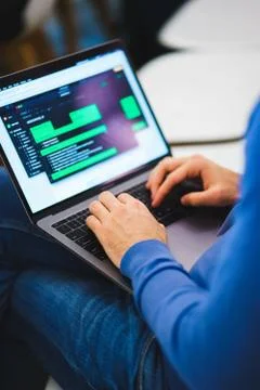 Developer of program code. Process of writing code in a special application. Stockfoto's