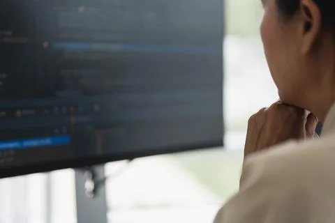 Developer programmer checking code on monitor while programming to developi.. 스톡 사진