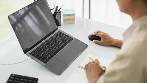 Developer programmer use mouse and checking code on laptop while programmin.. 스톡 사진