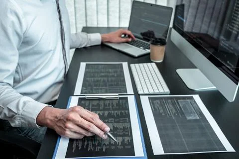 Developer programmer working on coding program software computer in office, W Stock-Fotos