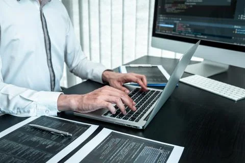 Developer programmer working on coding program software computer in office, W Stock Photos