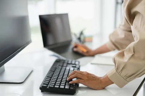 Developer programmer working on computer and laptop while programming code .. Foto stock