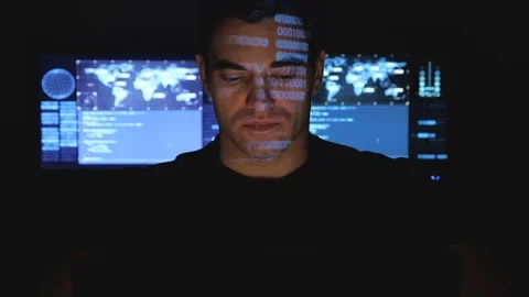 Developer programmer working on computer in a data center while blue code Stock Footage 102927518
