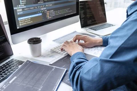 Developer programmer working on project in software development computer in I Stock Photos