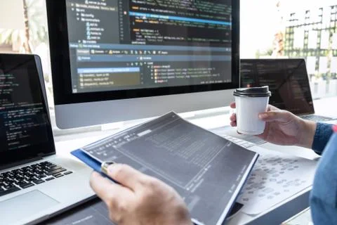 Developer programmer working on project in software development computer in I Stock Photos