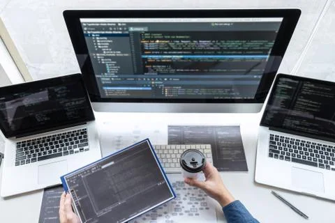 Developer programmer working on project in software development computer in I Stock Photos