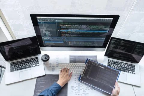 Developer programmer working on project in software development computer in I Stock Photos