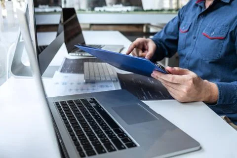 Developer programmer working on project in software development computer in I Stock Photos