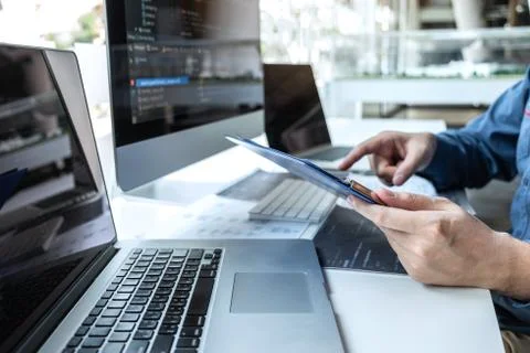 Developer programmer working on project in software development computer in I Stock Photos
