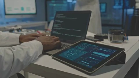 Developer Programs Advanced Robot Tech in Secret Lab at Night Stock Footage 320503855