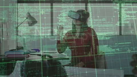 Developer putting on VR headset activating green overlay while editing code Stock Footage 319682408