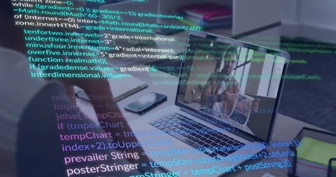 Developer reviewing code overlay while glancing notebook in remote call with Stock Footage 311225931