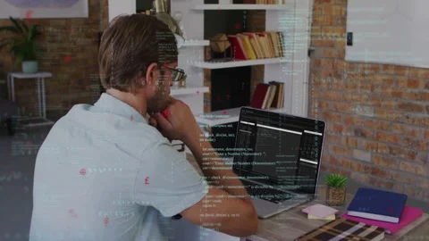 Developer scanning code at desk in office laptop updating and code overlays Stock Footage 335282083