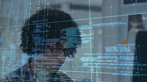 Developer scanning code on monitor, reading code overlay and typing while Stock Footage 332937044