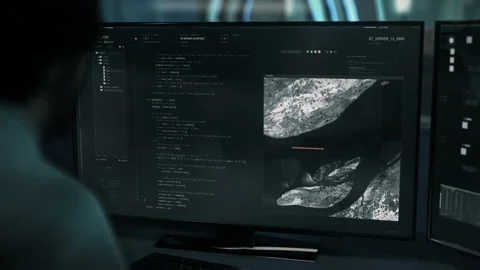 Developer scrolls through the written programming code of the digital matrix Stock Footage 236709385