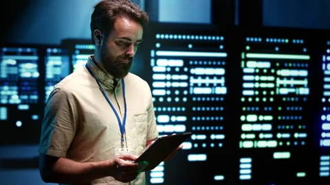 Developer in server room Stock Footage 246714738