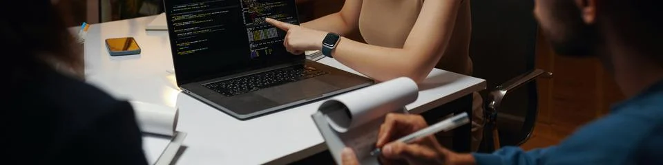 Developer Showing Code on Laptop 스톡 사진