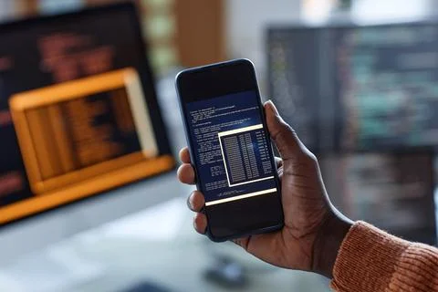 Developer Showing Code on Smartphone Stock Photos