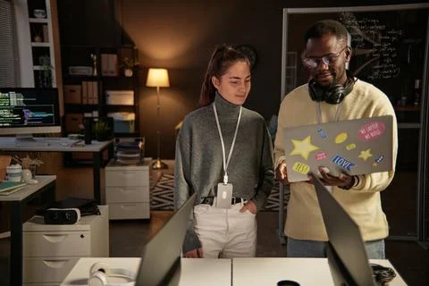 Developer Showing Coworker Elegant Solution 写真素材