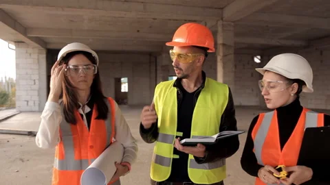 The developer shows his clients how the construction of their object is moving Stock Footage 97807846