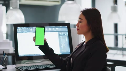 Developer shows mobile phone with greenscreen template Stock Footage 262997852