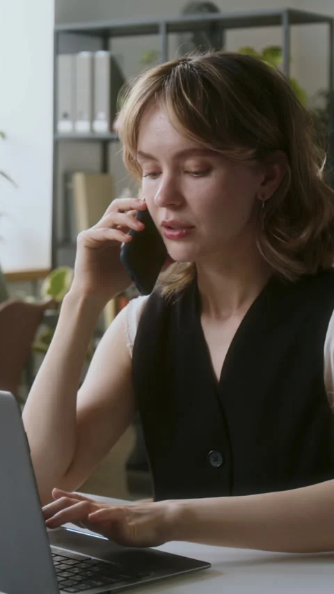 Developer Speaking on Smartphone Stock Footage 313485059