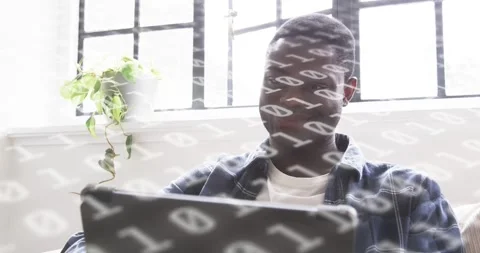 Developer starting code analysis, binary digits floating across laptop while Stock Footage 319678835