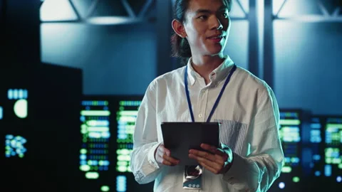 Developer strolling through data center Stock Footage 249563403