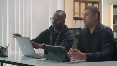 Developer Talking to Director about New Application for Devices Stock Footage 252569804