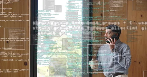 Developer tapping smartphone starting phone call while lifting mug and streaming Stock Footage 314194275