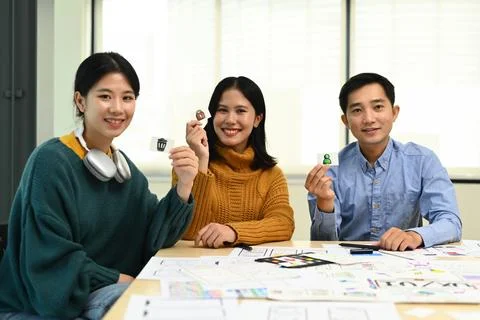 Developer team collaborating and planning template layout for mobile application Stock Photos