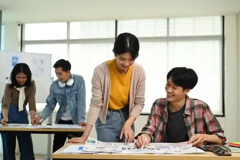 Developer team collaborating and planning template layout for mobile application Stockfoto's