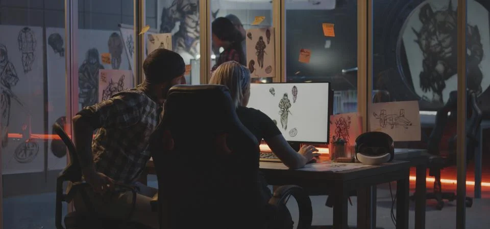 Developer team discussing game art 스톡 사진