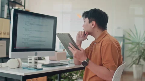 Developer Testing Application for Computers and Using Tablet Video stock 265072006