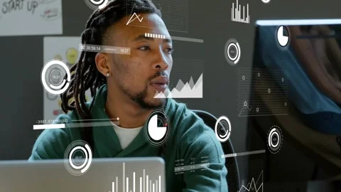 Developer turning toward coworker after ping, manipulating HUD charts on laptop Stock Footage 334038272