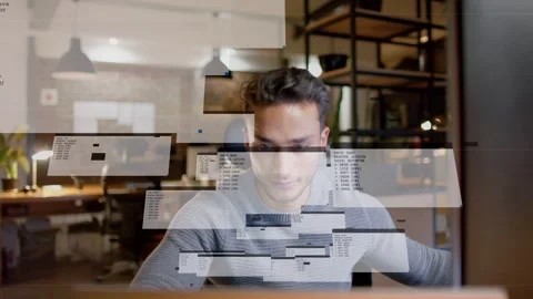 Developer typing and reaching for mouse at desk launching floating terminal Stock Footage 333033830