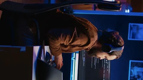 Developer typing code in home office to develop software application Stock Footage 265108781