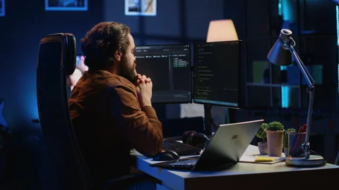 Developer typing code in home office to develop software application Stock Footage 265338946