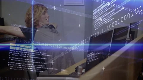 Developer typing code at monitors initiating stretch overlay easing tension then Stock Footage 329851025