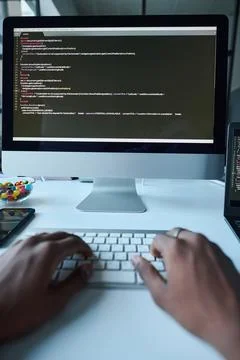 Developer typing codes on computer Stockfoto's