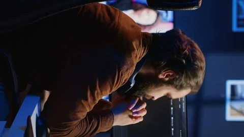 Developer typing complex code in neon lit home office, listening music Stock Footage 265108989