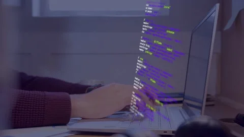 Developer typing with hands on laptop keys causing color code overlay scrolling 動画素材 333893862
