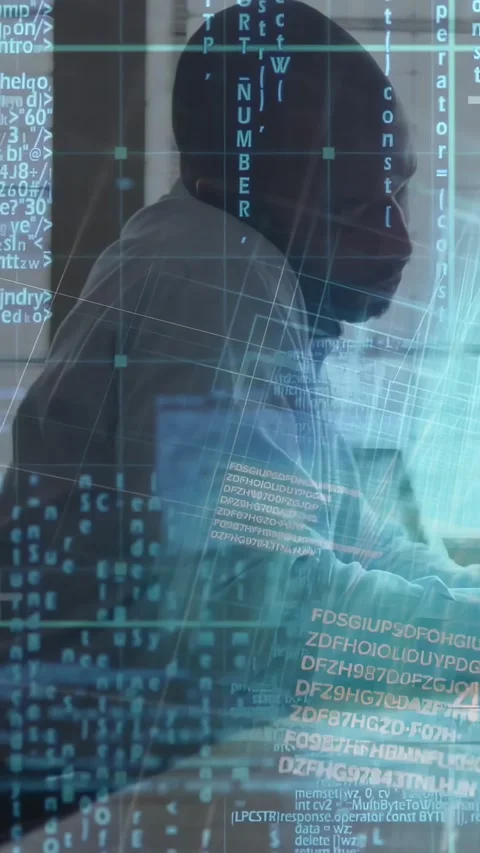 Developer typing on keyboard and leaning, initiating AR code-grid overlay while Stock Footage 330982724