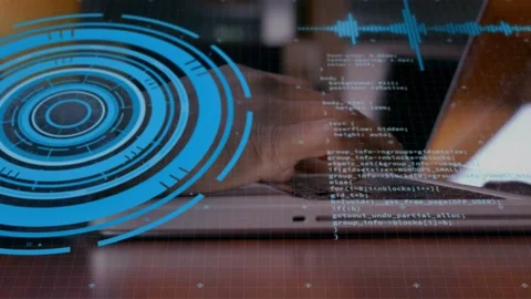Developer typing on laptop keyboard, starting code scroll while blue HUD over Stock Footage 334744328