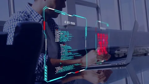 Developer typing laptop in lounge, activating HUD updating code and red matrix, Stock Footage 333924979