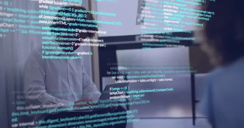 Developer typing on laptop in office showing scrolling code overlay revealing Stock Footage 312346981