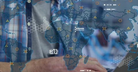 Developer typing on laptop in tech office, activating animated world map with Stock Footage 317370145