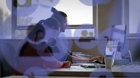 Developer typing mouse, causing UX icons and code overlay while colleague Stock Footage 328366162