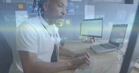 Developer typing while camera moving closer, HUD overlays showing screen data Stock Footage 330426157